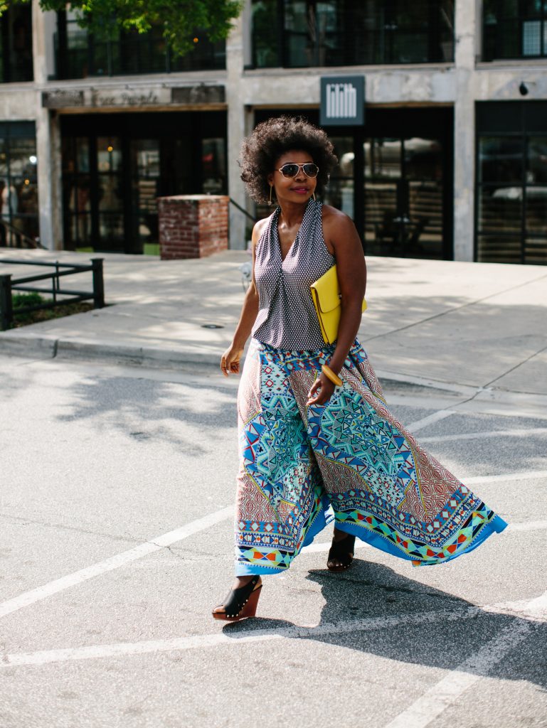 woman walking across the street in maxi skirt