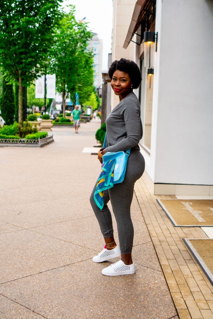 Woman outside with a blue cross body bag