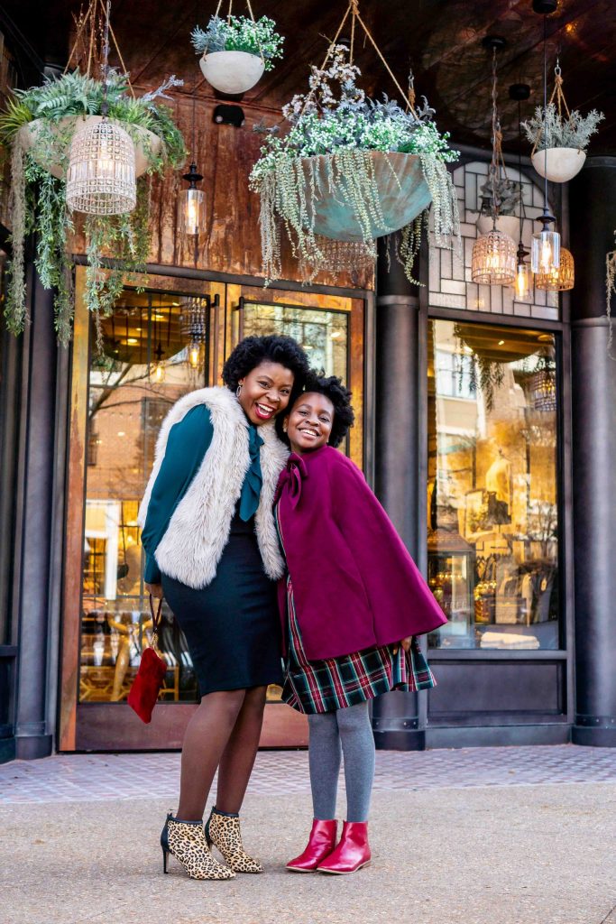 Mother and daughter dressed well in red and blue