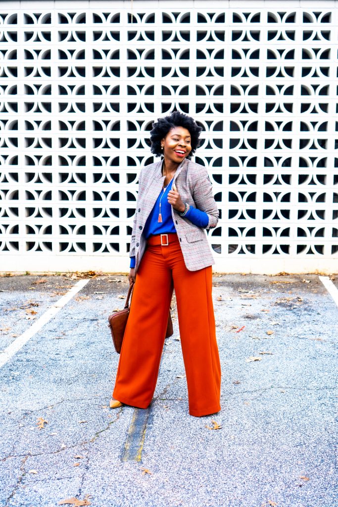 woman wearing plaid blazer and orange pants