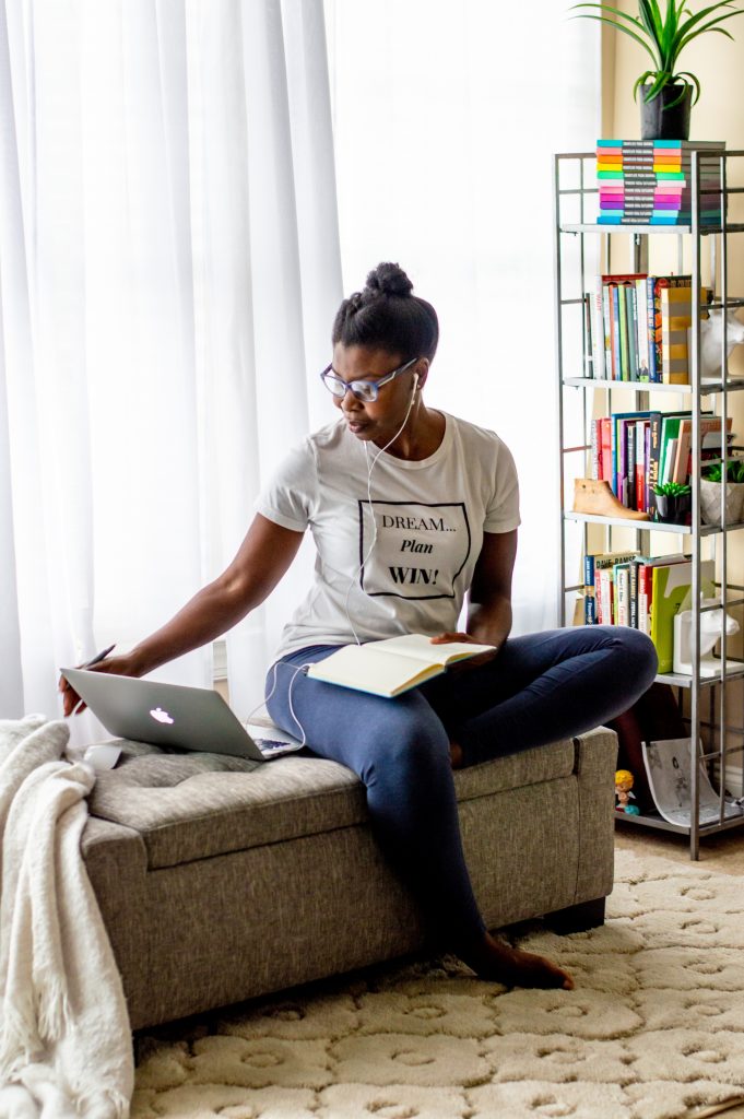 5 Tips for Working From Home and Homeschooling During Self-Quarantine featured by top Atlanta lifestyle blogger, Hurry in Time: woman sitting on couch looking at a computer